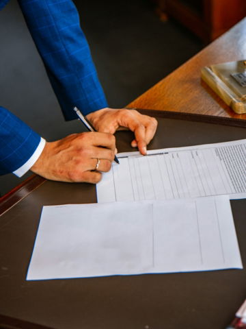person-writing-on-white-form-paper.jpg person writing on white form paper